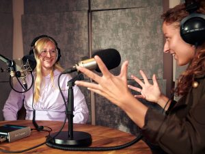 people recording a podcast in a studio